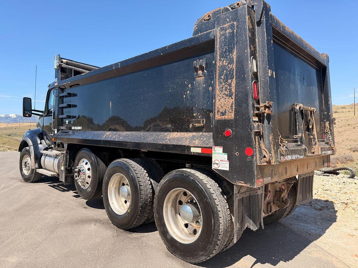 Used 2023 Kenworth T880 tri-axle dump truck, 123,870 miles