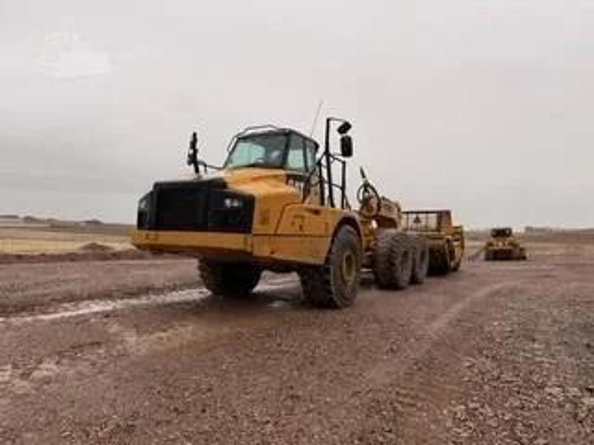 Used Caterpillar 740B, articulated dump truck with KTec Scraper