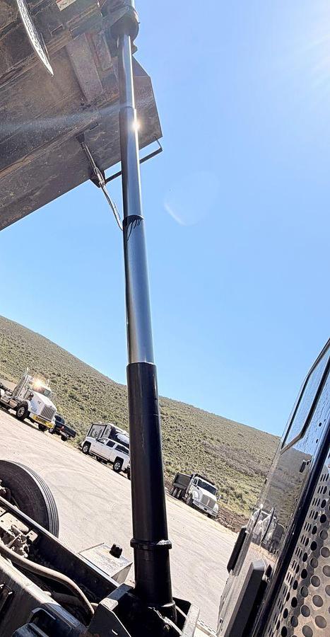 Used 2023 Kenworth T880 tri-axle dump truck, 123,870 miles
