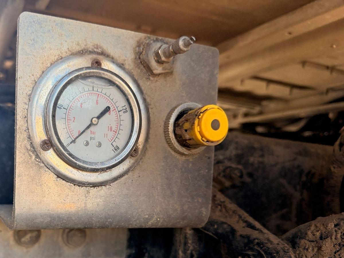 Used 2023 Kenworth T880 tri-axle dump truck, 123,870 miles