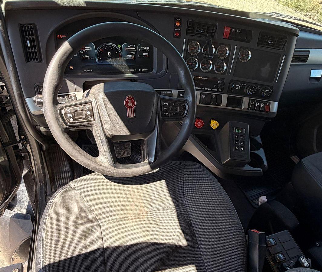 Used 2023 Kenworth T880 tri-axle dump truck, 123,870 miles