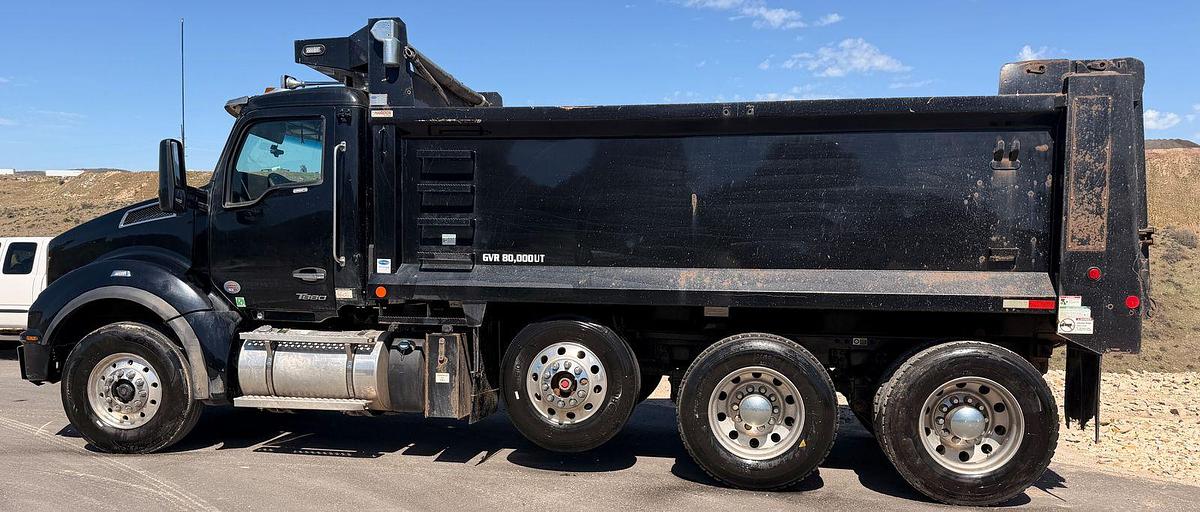 Used 2023 Kenworth T880 tri-axle dump truck, 123,870 miles