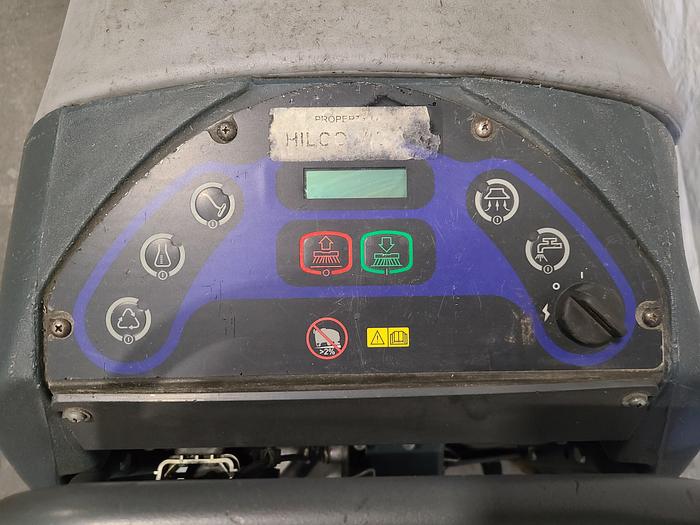 Used Convertamatic Floor Scrubber (A) with Built-in Charger.