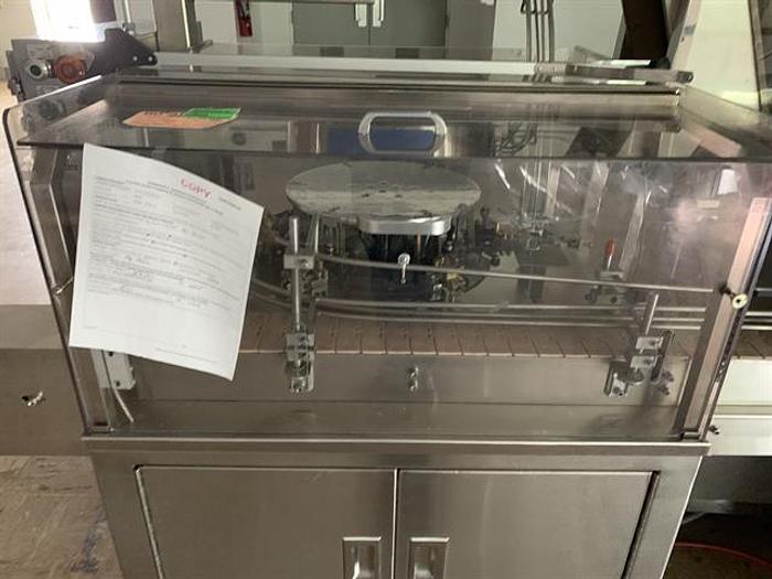 Used Omega RP-1 bottle unscrambler