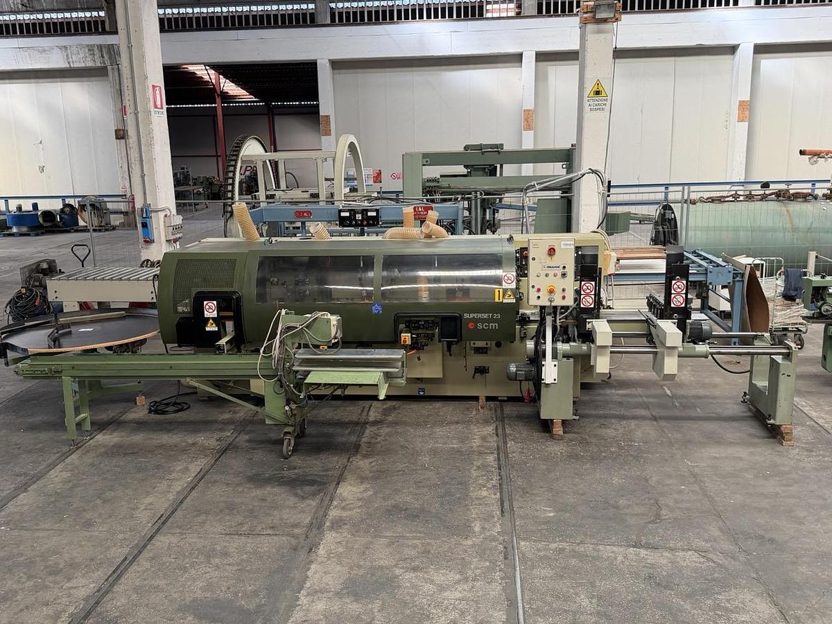 Usato 1995 SCM Superset 23 Plus Scorniciatrice marchiata CE, a 6 alberi, banco da mm. 230 con piano rigato.