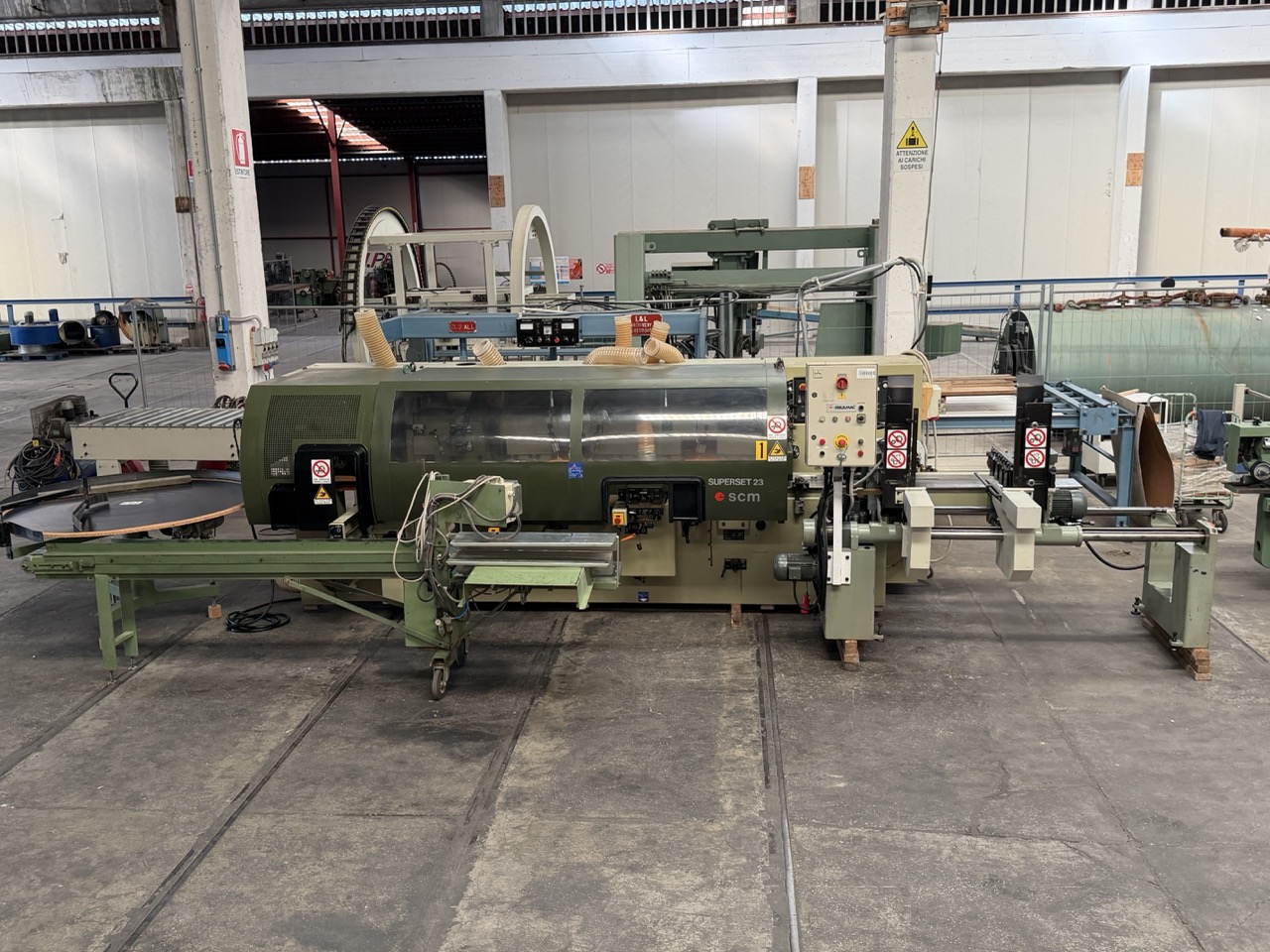 Usato 1995 SCM Superset 23 Plus Scorniciatrice marchiata CE, a 6 alberi, banco da mm. 230 con piano rigato.
