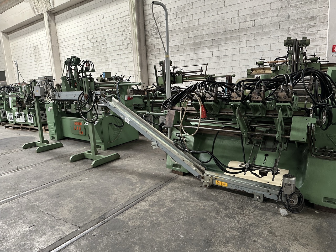 Usato Linea di tornitura e levigatura automatica, con Tornio Oma e Levigatrice Genini da 1200 mm