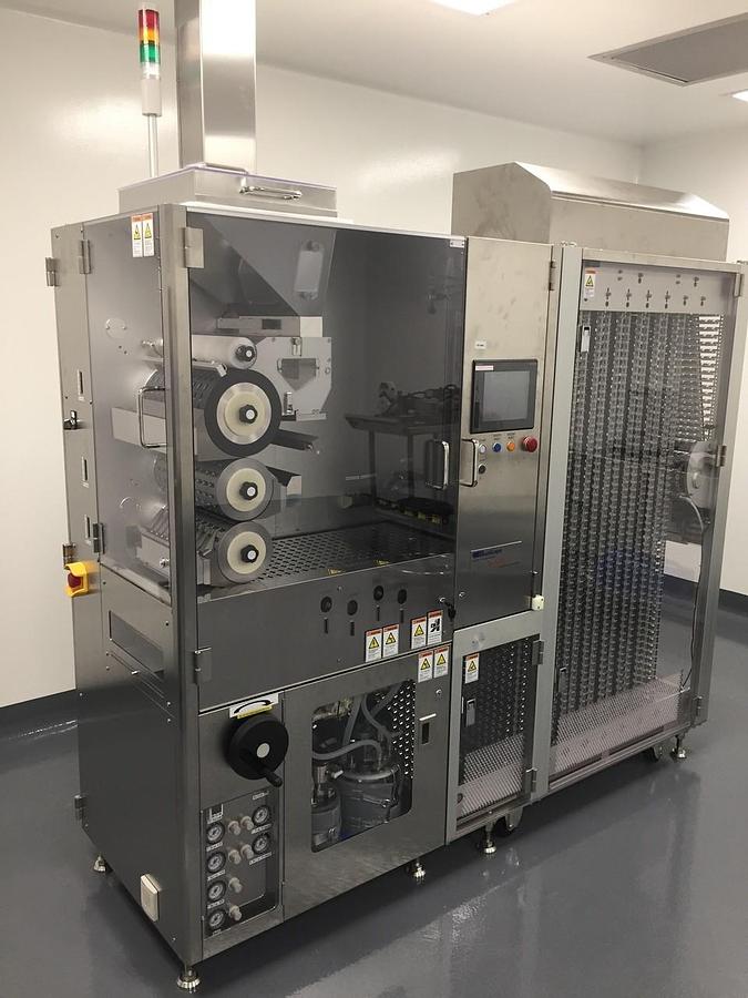 Used (2)  Qualicaps  filling  and  sealing  machine