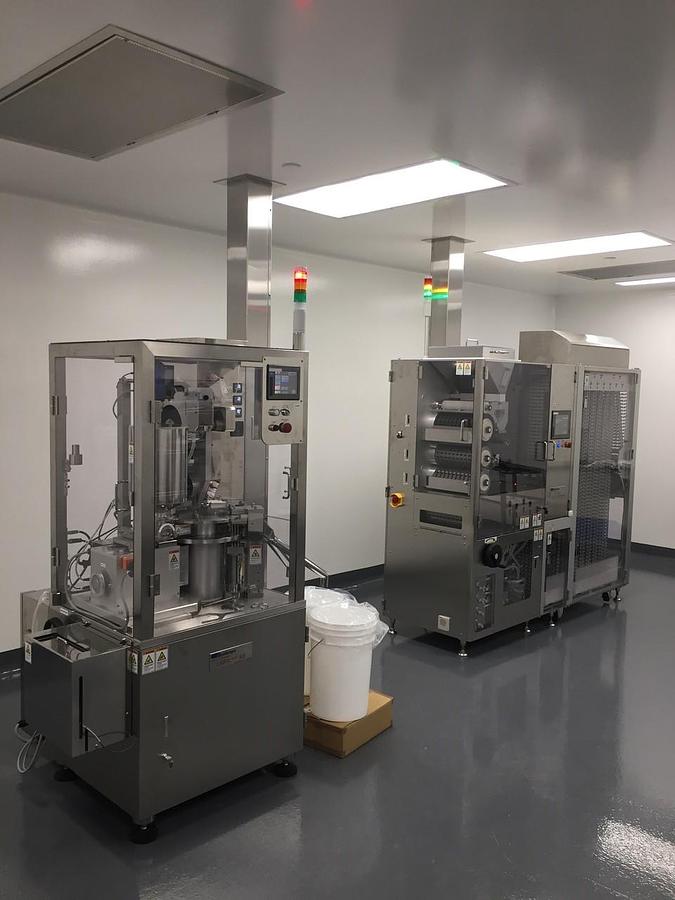 Used (2)  Qualicaps  filling  and  sealing  machine