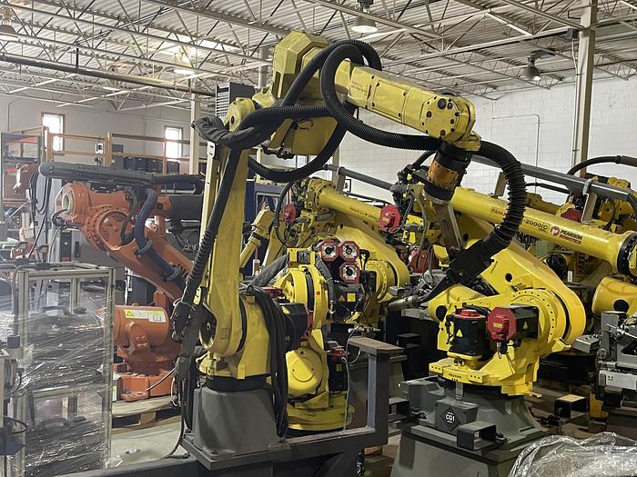 Used FANUC ARCMATE 120iC/10L MIG WELDING CELL WITH 2 AXIS 10' LONG DROP CENTER TRUNNION W/ROTARY CNC TABLE