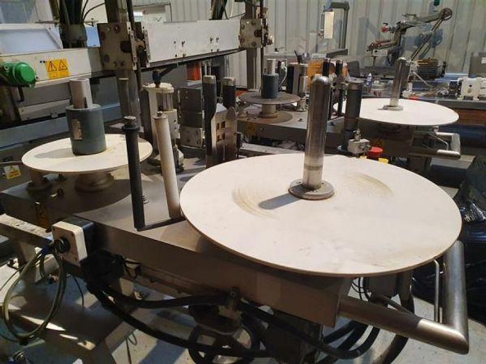 Used 2002 Graham Captain Twin Head Labeller with Top Hold Conveyor