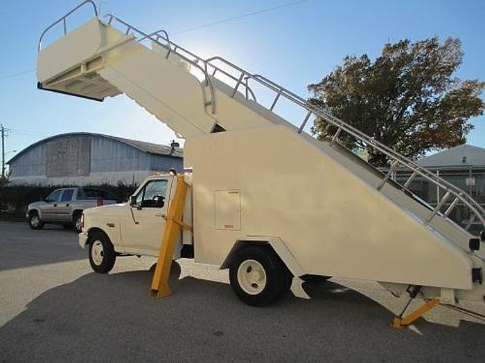 Used Hobart/Wollard Stair Truck. Services wide body aircraft. Max Height 17' Model: TLPH252SM.