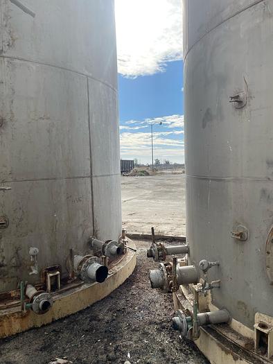 Used Stainless Steel 25,000 Gallon Vertical Tanks