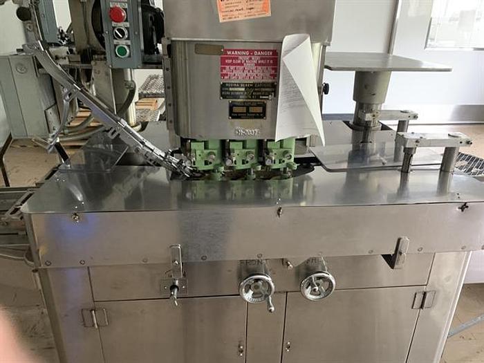 Used Resina U-30 Stainless steel base capper