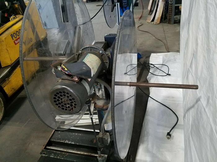 Used Rapid Motorized Double Sided Stock Reel Material Feed with control panel