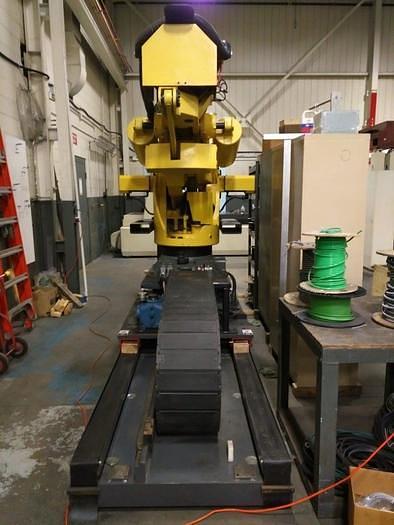 Used 2012 FANUC  M900iB/700 6 AXIS CNC ROBOT WITH R30iB CONTROLLER  & 7TH AXIS 15' LONG TRACK.