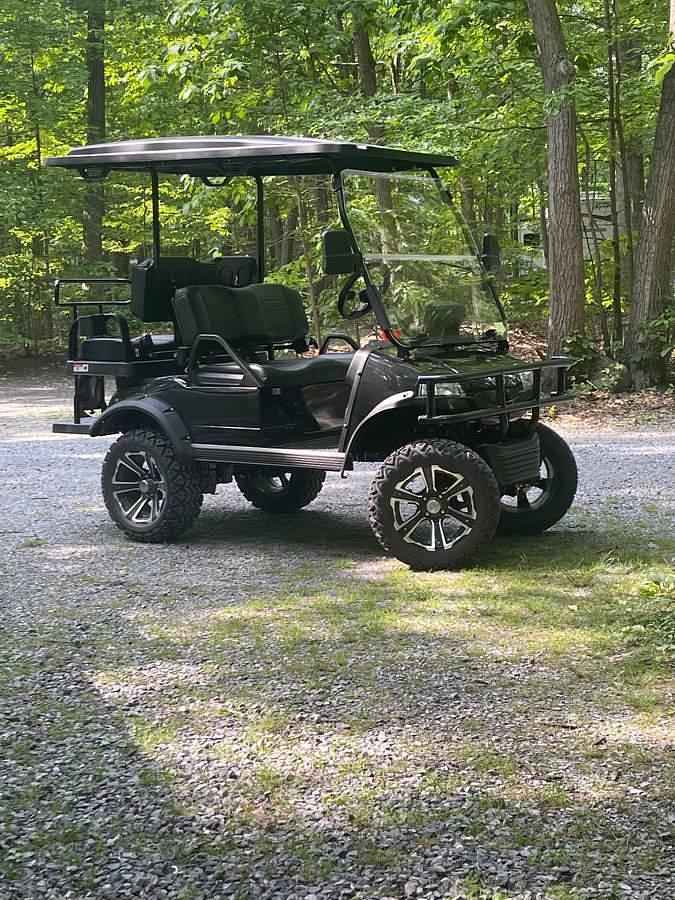 Used Two Story Park Model Trailer With 2022 Evolution Forester Golf Cart