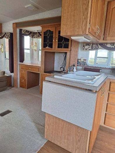 Used 2012 RAM 2500 and 2003 NuWa Hitchhiker Discover America