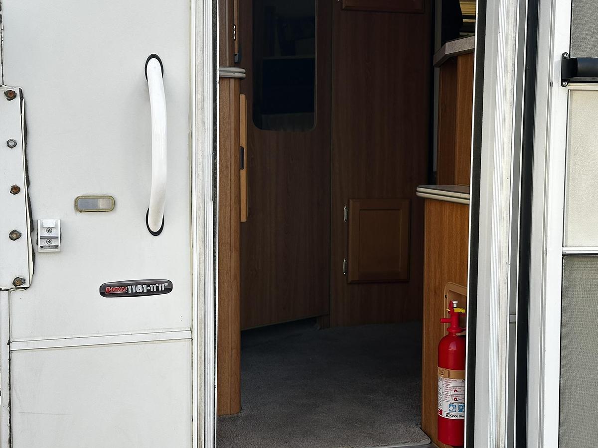 Used 2004 Lance 1161 Cab Over Camper Mounted on a 2005 Ford F350 Lariat