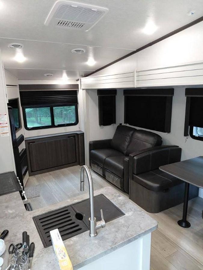 Used 2024 Keystone Cougar 2400RE Fifth Wheel and a 2024 GMC Sierra 2500