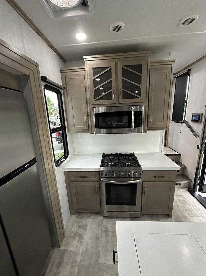 Used 2023 Grand Design Momentum M-395MS Fifth Wheel Toy Hauler