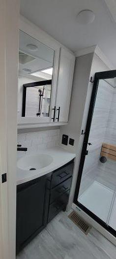 Used 2022 Forest River Riverstone Legacy Fifth Wheel Toy Hauler