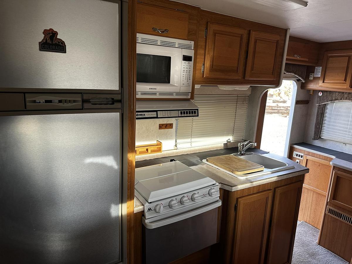 Used 2004 Lance 1161 Cab Over Camper Mounted on a 2005 Ford F350 Lariat