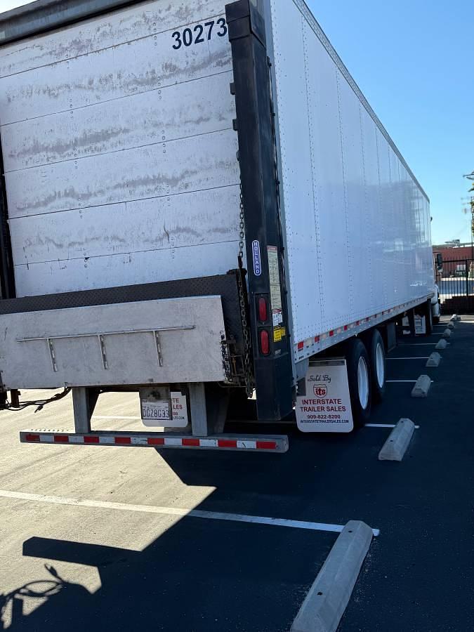 Used 2014 Freightliner M2 112 and 2010 Vanguard 48x102 4500# Holland with ETrac Trailer