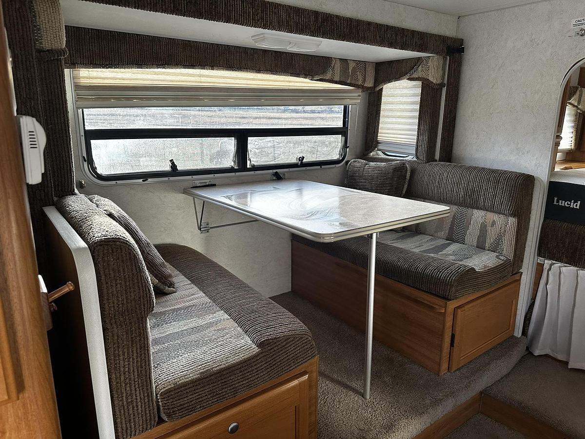 Used 2004 Lance 1161 Cab Over Camper Mounted on a 2005 Ford F350 Lariat