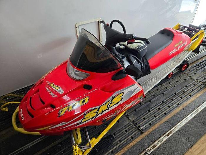 Used 2005 and 2003 Polaris Snowmobiles with a Thule Snopro Three Place Trailer