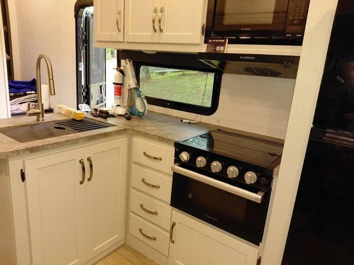 Used 2024 Keystone Cougar 2400RE Fifth Wheel and a 2024 GMC Sierra 2500