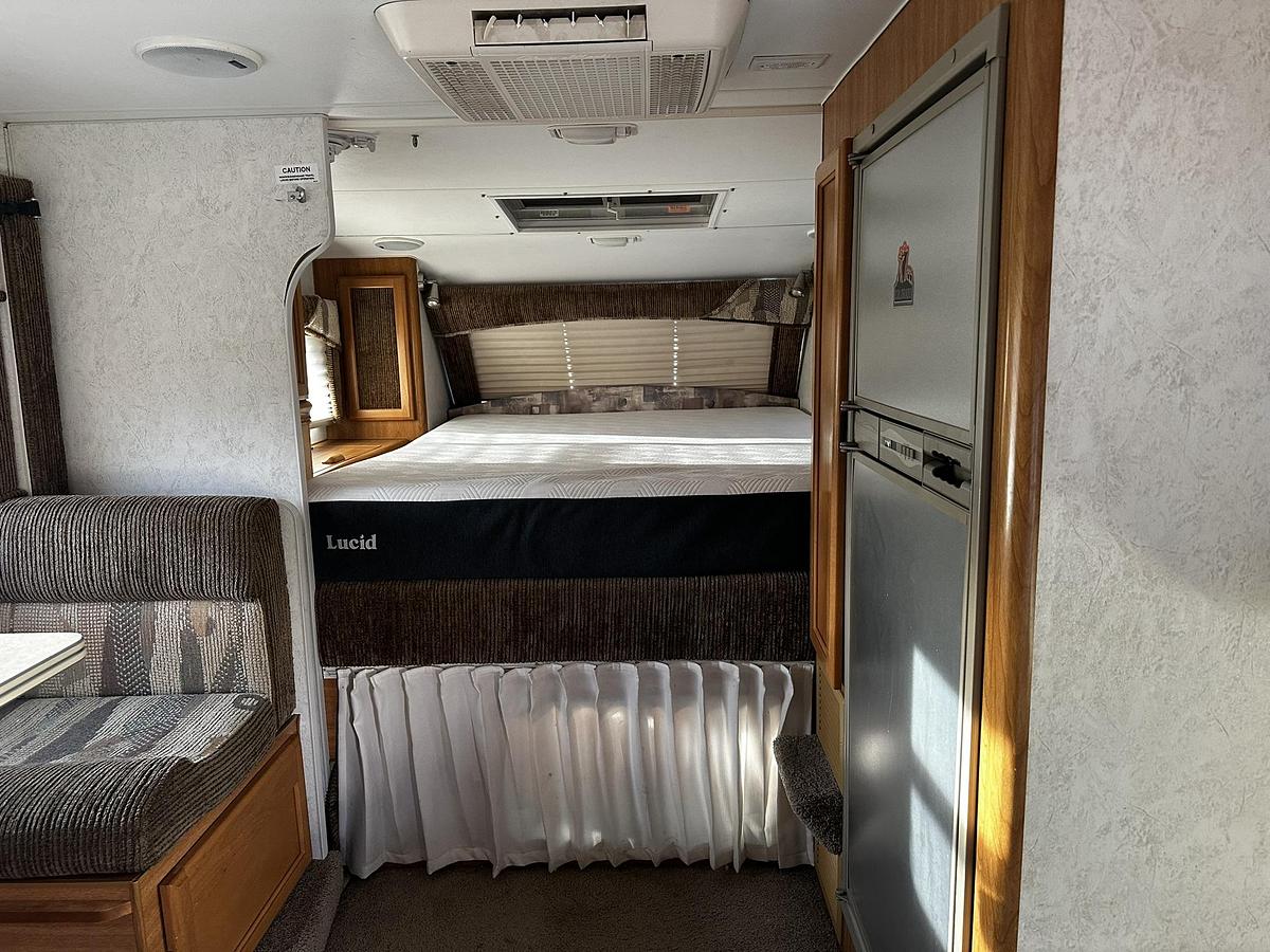 Used 2004 Lance 1161 Cab Over Camper Mounted on a 2005 Ford F350 Lariat