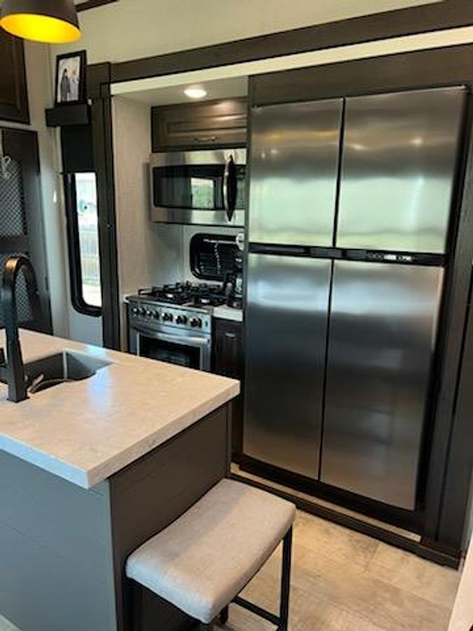 Used 2021 Grand Design Momentum 5th Wheel Toy Hauler