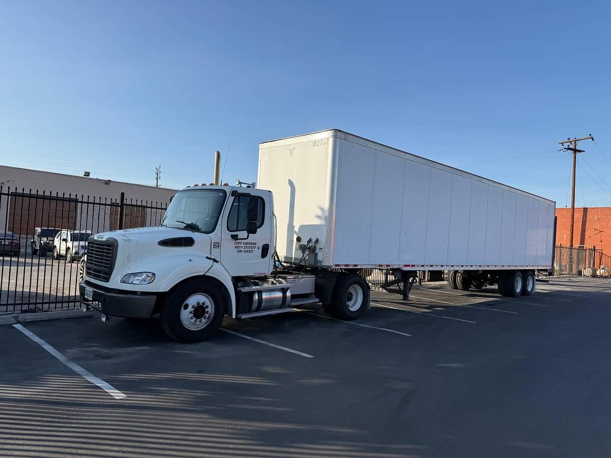 Used 2014 Freightliner M2 112 and 2010 Vanguard 48x102 4500# Holland with ETrac Trailer