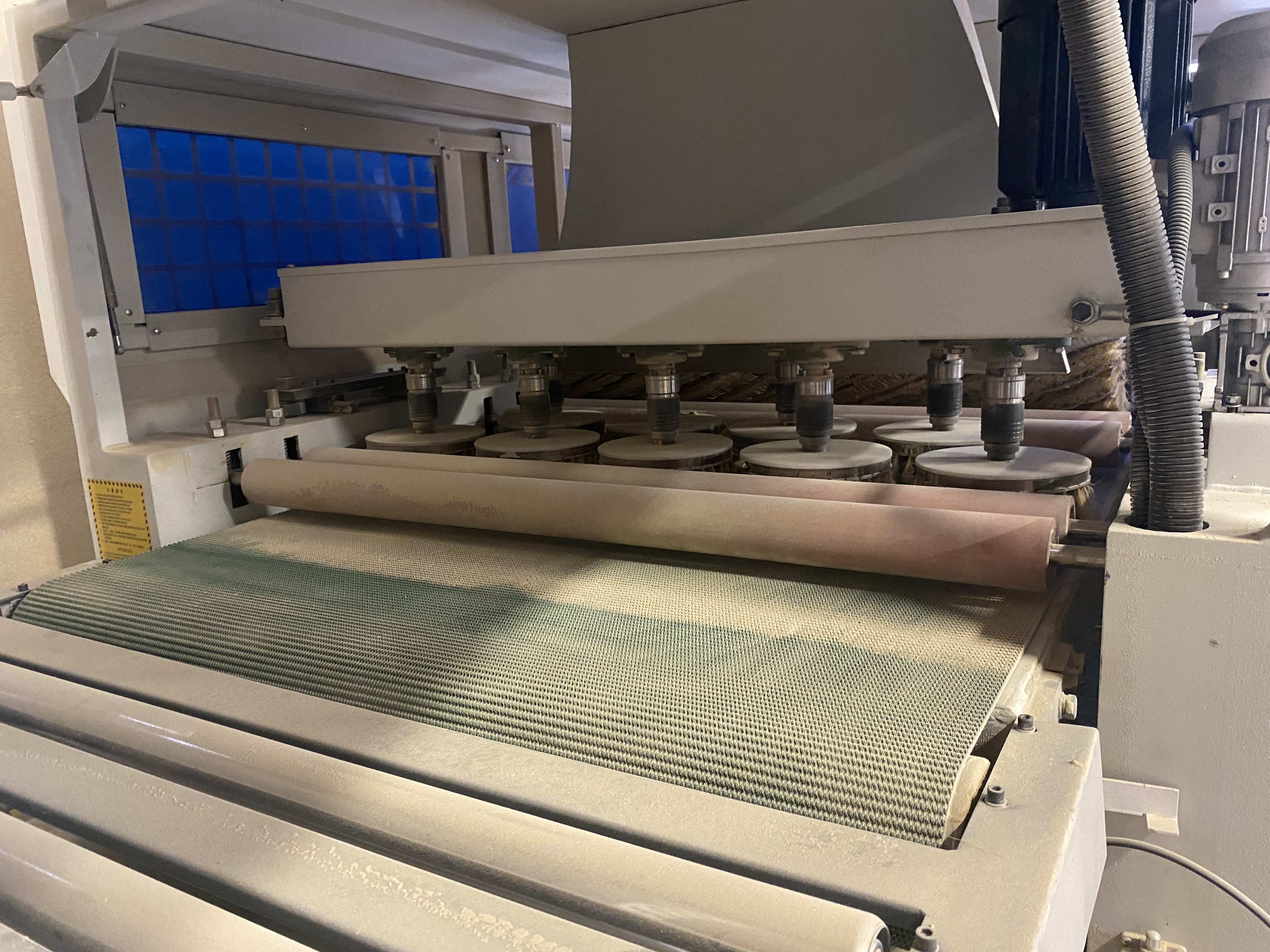 Used 2017 Quingdao KC1000-2YP-4R 18 discs sanding brush 4 long sanding roller sanding machine