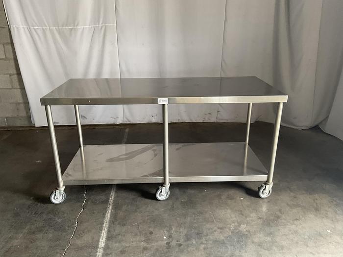 Used 72" COMMERCIAL TALBLE WITH CASTERS !