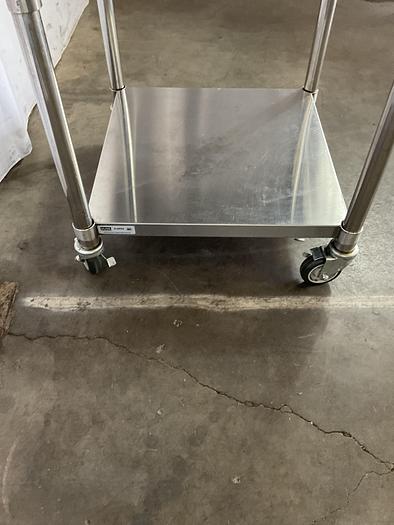 Used STAINLESS STEEL ULINE ROLLING EQUIPMENT TABLE