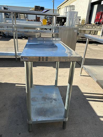 Used STAINLESS STEEL WORK TABLE./