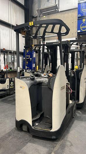 Used CROWN ACCESSES-123 STAND-UP FORKLIFT