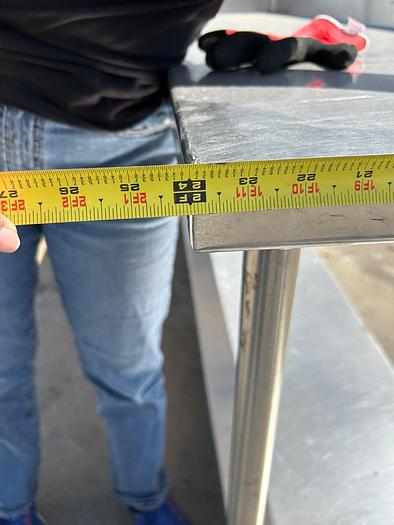 Used 7FT STAINLESS STEEL TABLE WITH BACK SPLASH AND CASTERS