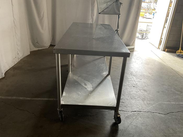Used 72" COMMERCIAL TALBLE WITH CASTERS !