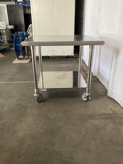 Used STAINLESS STEEL ULINE ROLLING EQUIPMENT TABLE