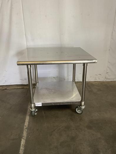 Used STAINLESS STEEL ULINE ROLLING EQUIPMENT TABLE