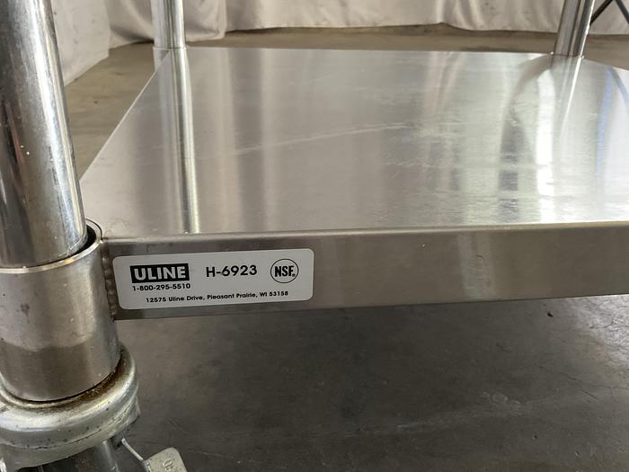 Used STAINLESS STEEL ULINE ROLLING EQUIPMENT TABLE