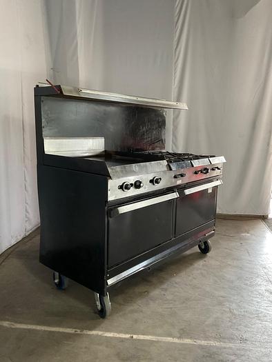 Used  6 BURNER RANGE WITH FLAT GRIDDLLE AND 2 STANDARD OVENS ./