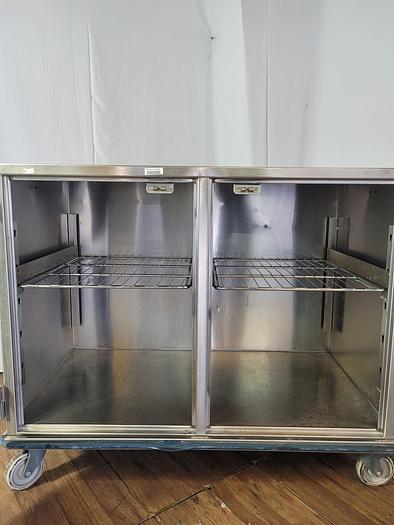 Used STAINLESS STEEL CASE CART WITH TWO DOORS AND WIRE SHELF !