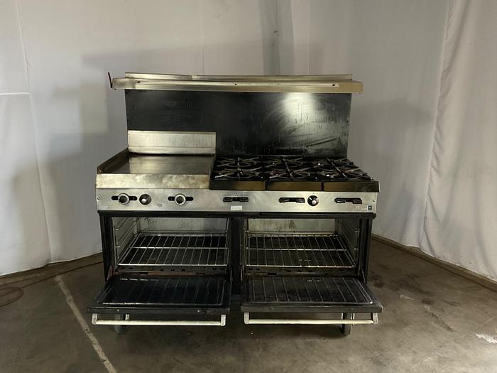 Used  6 BURNER RANGE WITH FLAT GRIDDLLE AND 2 STANDARD OVENS ./