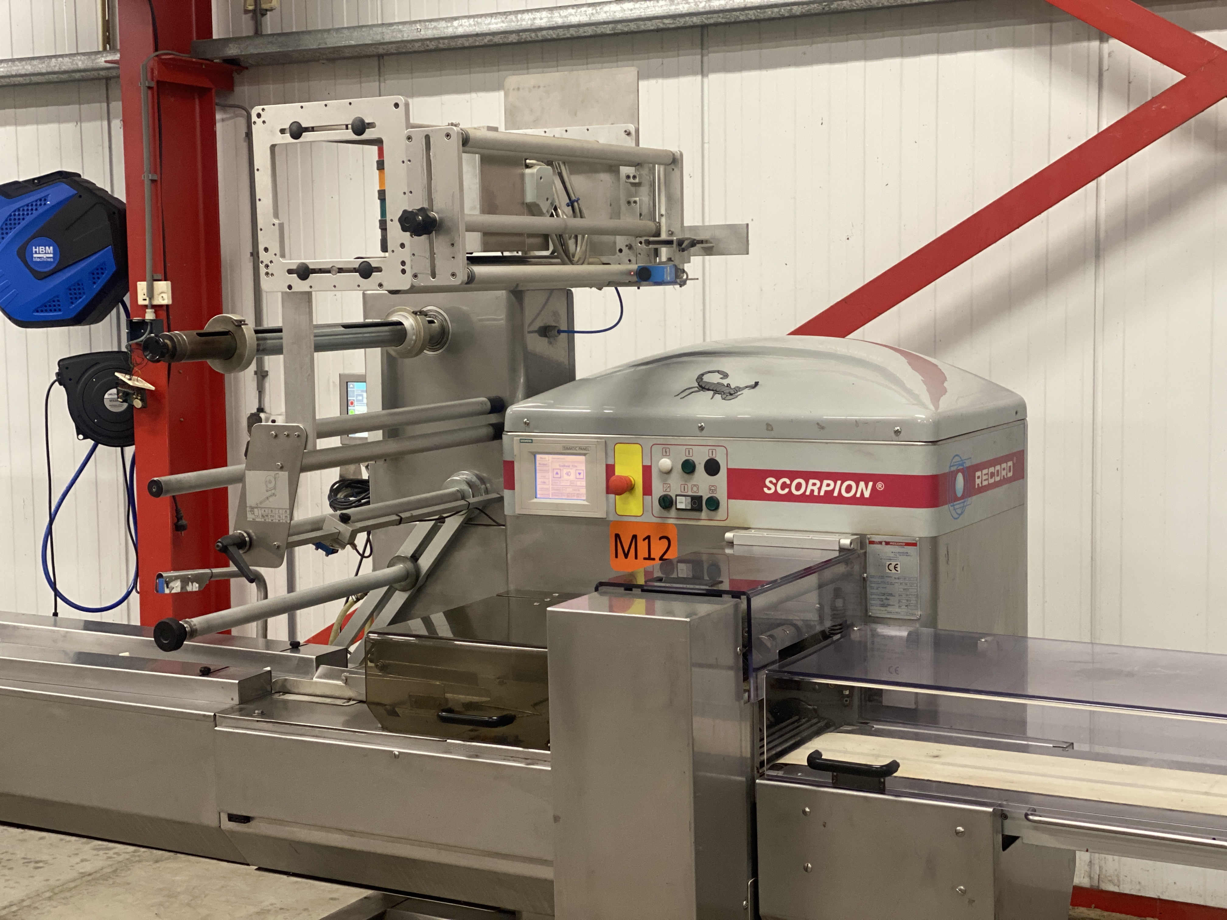 Used Record Scorpion MD flowpacker with Automotion automatic infeed