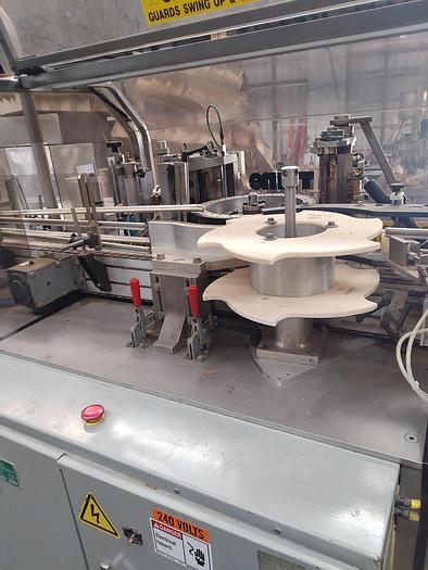 Used TRine 4500 roll fed labeler - hot melt