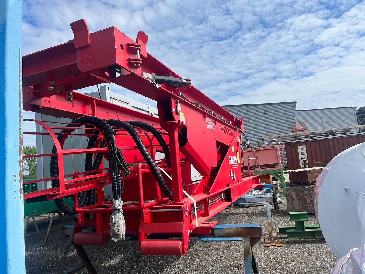 Tilting container loader